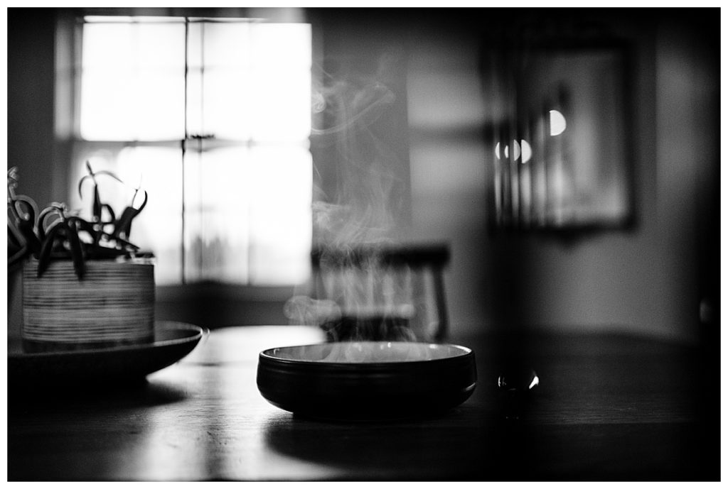 black and white image of a steaming bowl of soup