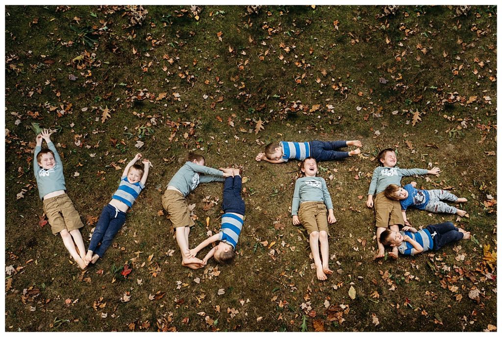 boys spell out the word VOTE with their bodies