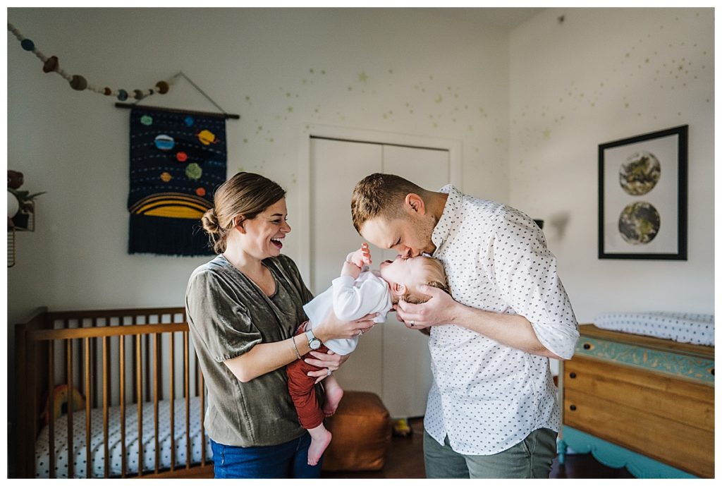 playful family with toddler son during family photos