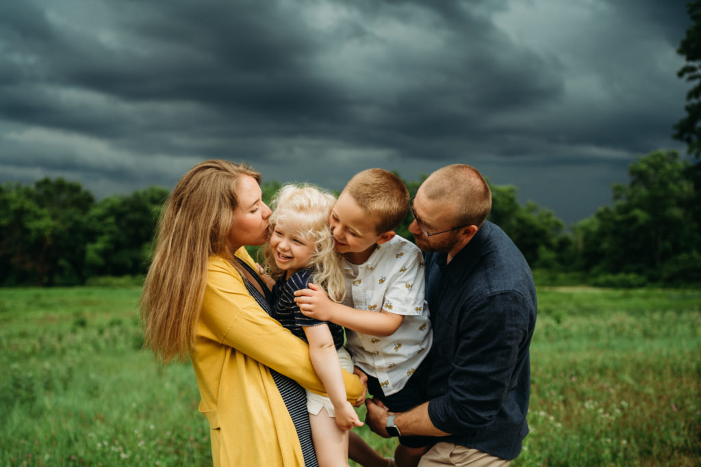 family session during a storm with black clouds