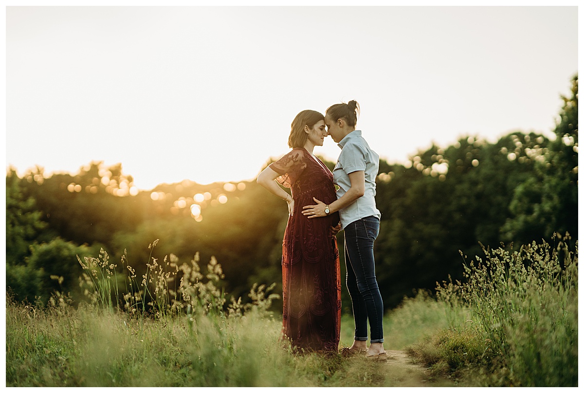 sunset maternity session with burgundy lace dress