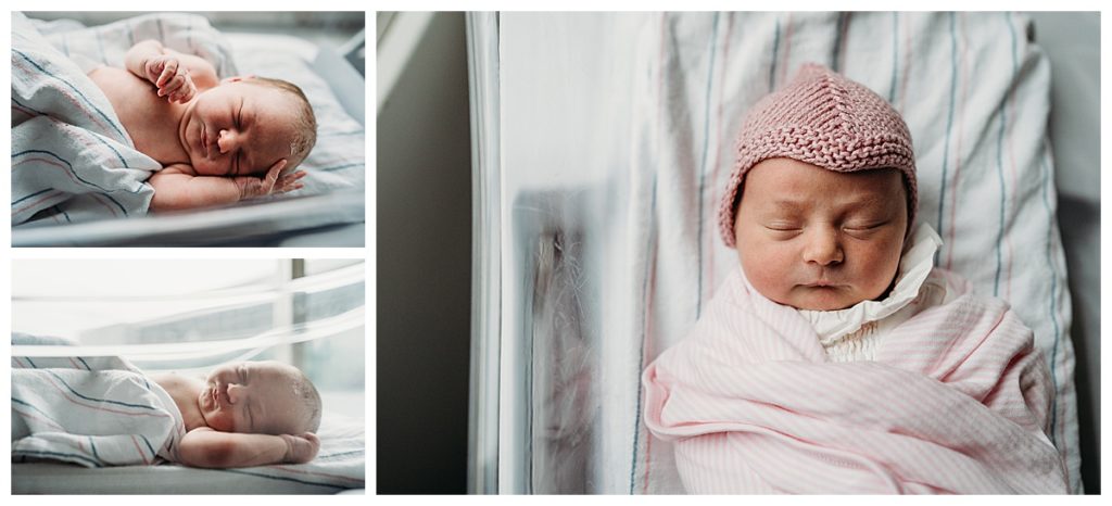 baby girl in purple hat lies in hospital bassinet