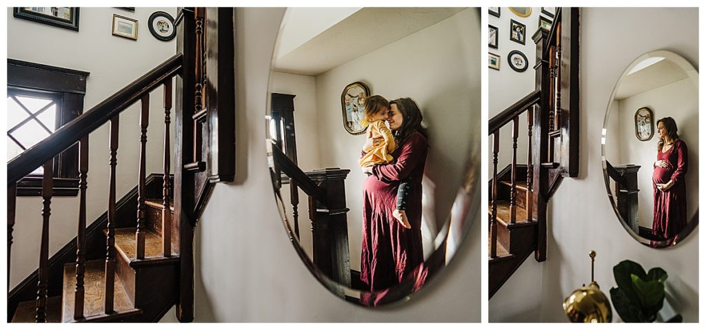 pregnant mom embraces toddler on stairs of home