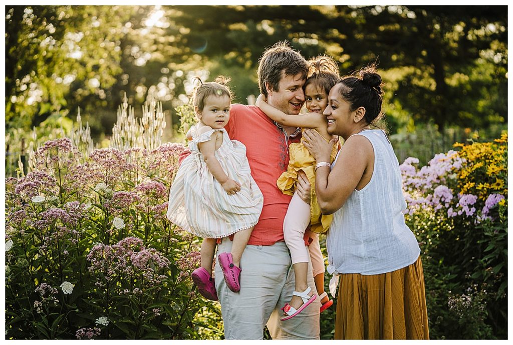 dreamy family photos in front of flowers
