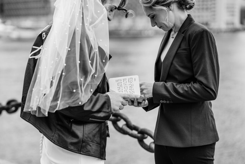 Couple reading private vows during intimate Boston elopement.